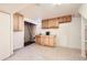 Basement area with cabinets, sink, tile flooring, and possible laundry hookups at 12333 Edwards Pl, Denver, CO 80239