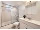 Bathroom featuring a shower-tub combination with white tiles and a vanity with storage at 12333 Edwards Pl, Denver, CO 80239