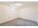 Bedroom featuring neutral carpet and a bright window at 12333 Edwards Pl, Denver, CO 80239