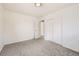 Spacious bedroom features neutral carpet and closet at 12333 Edwards Pl, Denver, CO 80239