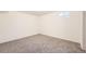 Bedroom featuring neutral carpet and a bright window at 12333 Edwards Pl, Denver, CO 80239