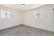Bright bedroom with two windows and neutral carpet at 12333 Edwards Pl, Denver, CO 80239