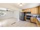 Contemporary kitchen featuring stainless steel appliances and seamless flow to the dining and living areas at 12333 Edwards Pl, Denver, CO 80239