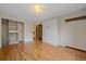 Bright bedroom with hardwood floors, closet space, and built-in wardrobe provides comfort at 1410 Vine St # 1, Denver, CO 80206