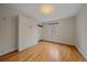 Bedroom featuring murphy bed, hardwood floors, and neutral walls at 1410 Vine St # 1, Denver, CO 80206