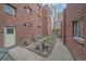 Cozy brick building courtyard with seating area, perfect for relaxing outdoors at 1410 Vine St # 1, Denver, CO 80206