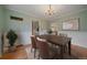 Dining room featuring a dark wood table and vintage chandelier at 1410 Vine St # 1, Denver, CO 80206