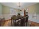 Dining room featuring a dark wood table with wainscotting and an elegant chandelier at 1410 Vine St # 1, Denver, CO 80206