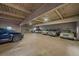Spacious parking garage interior offering parking spots for vehicles, bikes, and storage at 1410 Vine St # 1, Denver, CO 80206