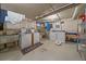 Functional laundry room featuring washers, dryers, and a utility sink at 1410 Vine St # 1, Denver, CO 80206