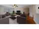 Inviting living room with hardwood floors, comfortable armchairs, and a large window at 1410 Vine St # 1, Denver, CO 80206