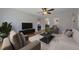 Cozy living room featuring hardwood floors, comfortable seating, and a ceiling fan at 1410 Vine St # 1, Denver, CO 80206