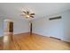 Bright living room with hardwood floors, ceiling fan and fresh interior paint at 1410 Vine St # 1, Denver, CO 80206