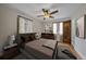 Bedroom with hardwood floors, neutral walls, ceiling fan, and natural light at 1410 Vine St # 1, Denver, CO 80206
