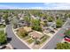 Aerial image shows a neighborhood with mature trees, well-kept lawns, and a grid street layout at 7736 Vallejo St, Denver, CO 80221