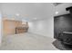 Spacious finished basement with carpet, recessed lighting, a decorative fireplace, and a built-in desk area at 7736 Vallejo St, Denver, CO 80221