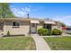Charming one-story brick home with well-maintained lawn and awning-covered windows at 7736 Vallejo St, Denver, CO 80221