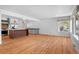 Spacious living area featuring hardwood floors and seamless access to the renovated kitchen at 7736 Vallejo St, Denver, CO 80221
