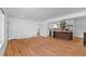 Open floor plan with hardwood floors connecting the living room to the updated kitchen at 7736 Vallejo St, Denver, CO 80221