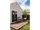 Backyard featuring a deck with chairs and a sliding glass door at 3910 S Grant St, Englewood, CO 80113