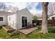 Backyard retreat with wooden deck, seating, and well-maintained lawn at 3910 S Grant St, Englewood, CO 80113