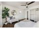 Bright bedroom with hardwood floors, ceiling fan, and closet at 3910 S Grant St, Englewood, CO 80113