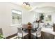 Bright dining area open to the kitchen, perfect for Gathering meals and entertaining guests at 3910 S Grant St, Englewood, CO 80113