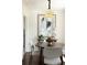 Bright dining area featuring a round table, four chairs, and a modern light fixture at 3910 S Grant St, Englewood, CO 80113