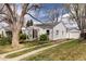 Inviting home with well-maintained lawn, driveway, and a detached garage in a suburban setting at 3910 S Grant St, Englewood, CO 80113