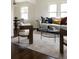 Stylish living area showcasing modern decor, hardwood floors, and an open layout for easy entertaining at 3910 S Grant St, Englewood, CO 80113