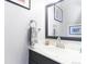 Simple bathroom with a vanity, mirror, and a clean aesthetic at 1693 Carr St # A, Lakewood, CO 80214