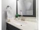 Updated bathroom featuring modern vanity, framed mirror, and attractive fixtures, adding a touch of elegance at 1693 Carr St # A, Lakewood, CO 80214