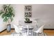 Bright dining area with modern table and chairs, complemented by stylish artwork and natural light at 1693 Carr St # A, Lakewood, CO 80214