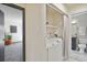 Convenient laundry area with modern machines and storage, located near the bathroom and bedroom at 1693 Carr St # A, Lakewood, CO 80214