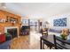 Bright living room featuring a fireplace and wood flooring at 1693 Carr St # A, Lakewood, CO 80214