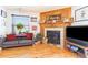 Living room with fireplace, wood floors and comfy seating at 1693 Carr St # A, Lakewood, CO 80214