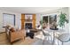 Inviting living room with a wood burning fireplace and sliding doors to the backyard deck at 1693 Carr St # A, Lakewood, CO 80214