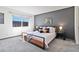 Stylish main bedroom with a modern accent wall, ample natural light, and contemporary furnishings at 1693 Carr St # A, Lakewood, CO 80214