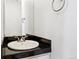 Bathroom featuring a round sink with black countertop and chrome faucet at 1914 E 16Th Ave, Denver, CO 80206