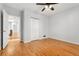 Bedroom featuring hardwood floors, a ceiling fan and closet with standard doors at 1914 E 16Th Ave, Denver, CO 80206
