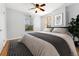 Comfortable bedroom with ample natural light and hardwood flooring at 1914 E 16Th Ave, Denver, CO 80206