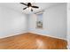 Bright bedroom featuring hardwood floors and a window with blinds at 1914 E 16Th Ave, Denver, CO 80206