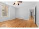 Spacious bedroom featuring wood floors and a large window for natural light at 1914 E 16Th Ave, Denver, CO 80206