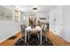 Elegant dining room featuring hardwood floors and a stylish light fixture at 1914 E 16Th Ave, Denver, CO 80206