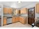 Bright kitchen with stainless steel appliances, granite countertops, and wooden cabinets at 1914 E 16Th Ave, Denver, CO 80206