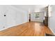 Open living room with hardwood floors and a decorative stone fireplace at 1914 E 16Th Ave, Denver, CO 80206
