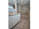 Bathroom with a white vanity and step-up bathtub at 13304 E Asbury Dr, Aurora, CO 80014