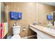 Cozy tiled bathroom featuring a vanity, toilet, and glass shower door at 13304 E Asbury Dr, Aurora, CO 80014