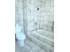 Bathroom with a step-up bathtub and decorative tile at 13304 E Asbury Dr, Aurora, CO 80014