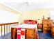 Bright bedroom with a ceiling fan, wood accents, and a cozy upstairs setting at 13304 E Asbury Dr, Aurora, CO 80014